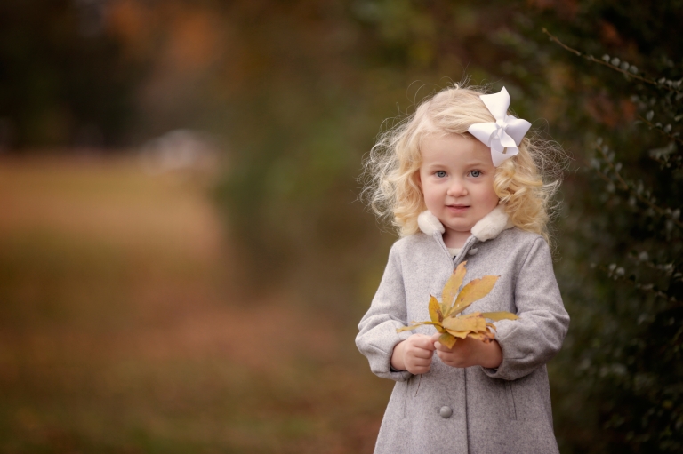 Raleigh child photography - little girl holding a leaf - Nicola Lane Photography