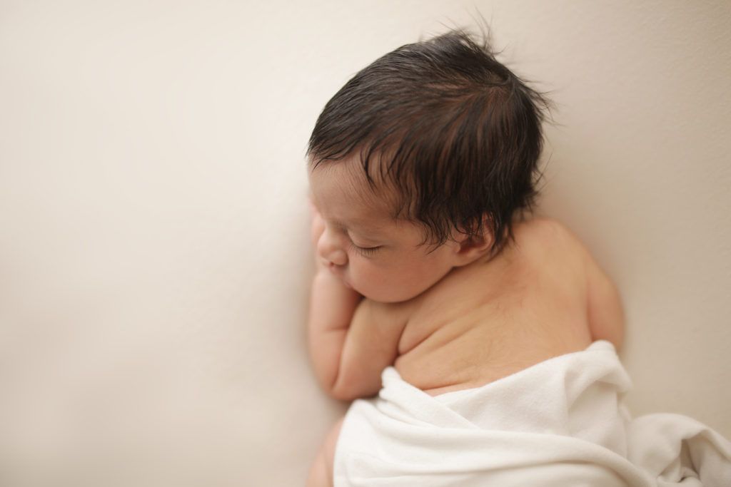 Sleeping newborn during a natural newborn photography session in Raleigh, NC