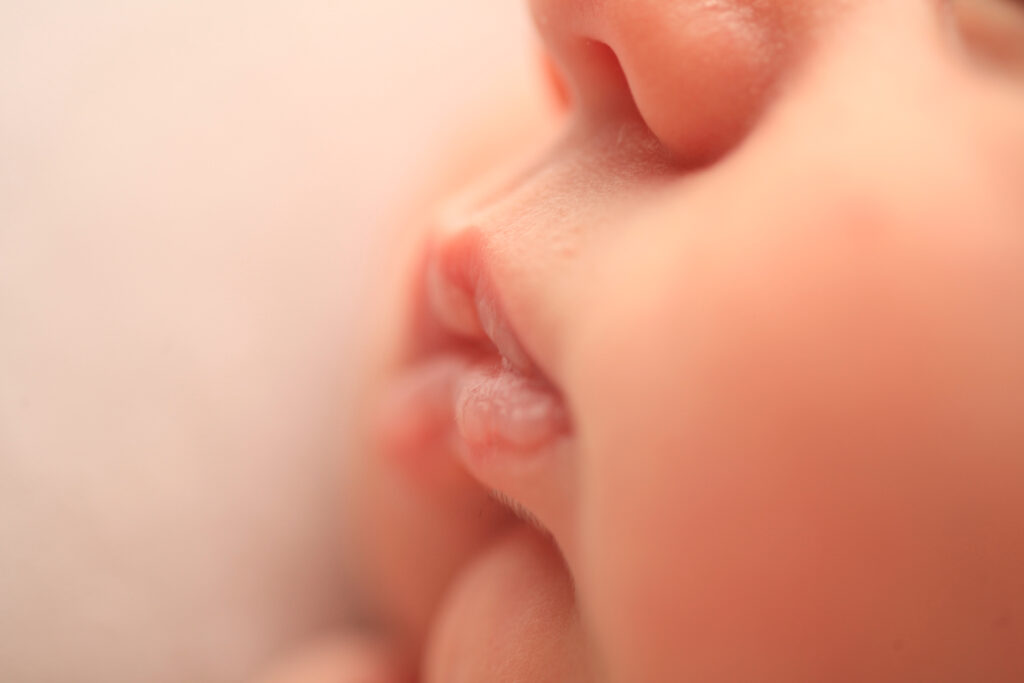 Close up of a newborn bby's lips during a professional newborn photography session in Raleigh, NC